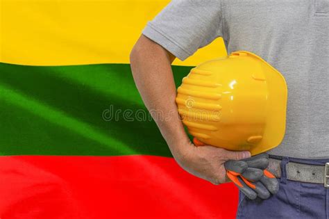 Hand of Worker and Yellow Hard-hat on Background Flag of Lithuania Stock Photo - Image of ...