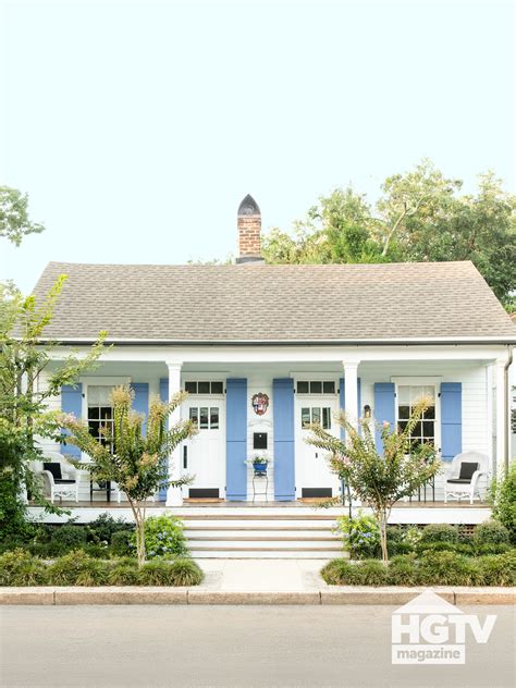 A white house with blue shutters from HGTV Magazine | White exterior ...