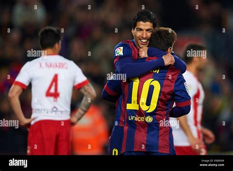 Luis Suarez (FC Barcelona) celebrates with his teammate Lionel Messi ...