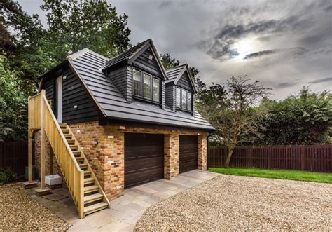 Traditional double garage with room in loft space | matching brick | slate roof | pitched dormer ...