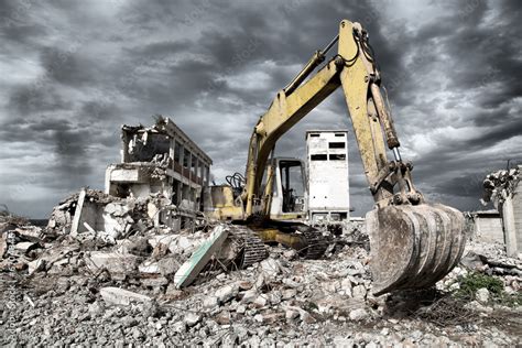 Bulldozer removes the debris from demolition of old buildings Stock ...