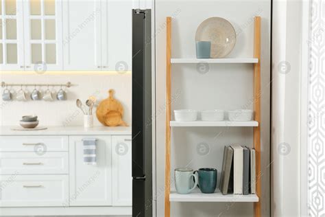 Decorative wooden ladder in stylish kitchen. Interior design: Stock Photo | Download on Africa ...