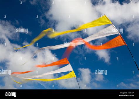 A Pair of Flags blowing in the wind Stock Photo - Alamy