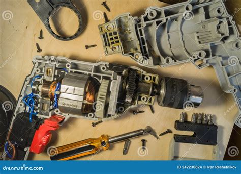 Repair of Electric Drill. Disassembled Working Power Tools Stock Photo ...