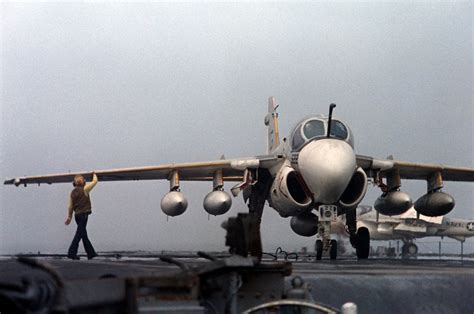 An A-6E Intruder aircraft rests on the flight deck after an arrested landing aboard the nuclear ...