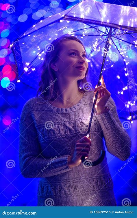 Girl in the Rain with an Umbrella with Lights and Creative Lighting Stock Image - Image of ...