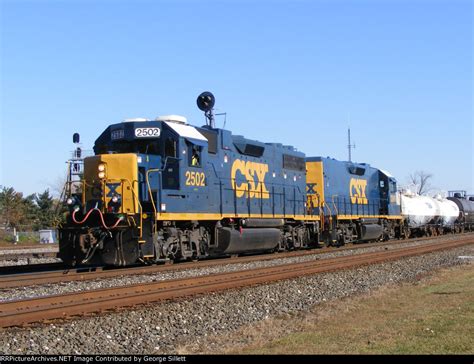 CSX GP38-2 2502 with a road slug lead a westbound mixed freight.