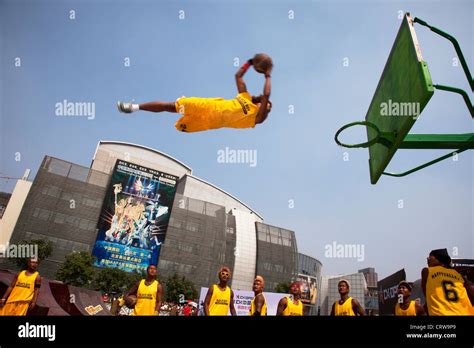 Basketball tricks team perform their slam dunk trick, flying through the air at Happy Valley ...