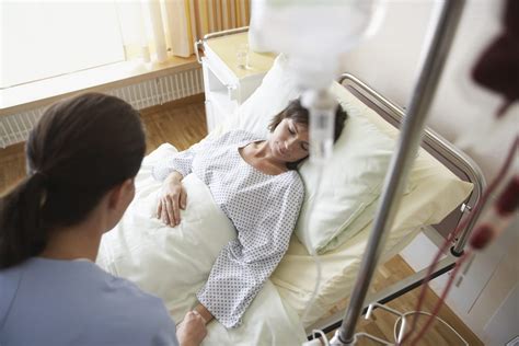 patient in hospital bed - Wyoming Department of Health