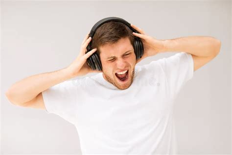 Man with Headphones Listening Loud Music Stock Image - Image of people, print: 32887147