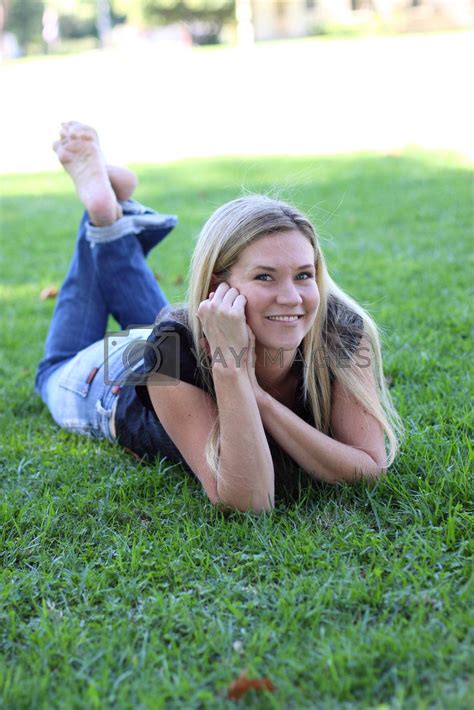 Barefoot Girl Lying In Grass