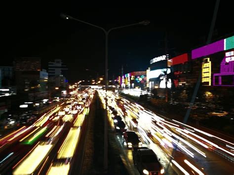 Premium Photo | Traffic light trails on road at night