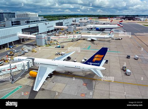 Airliners on concrete airport apron stands and connected to building Stock Photo: 70752186 - Alamy