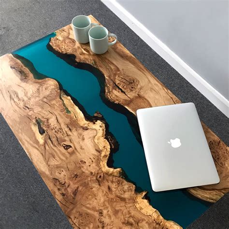 resin river coffee table with wooden legs by revive joinery | notonthehighstreet.com