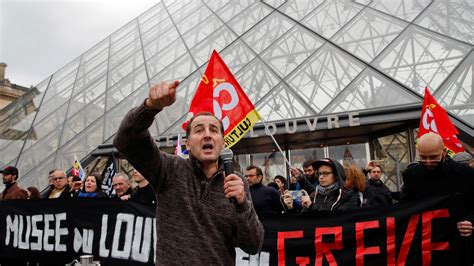 Emmanuel Macron rushed out of Paris theatre after protesters try to ...