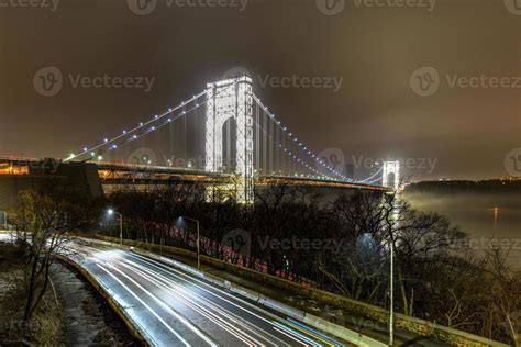 George Washington Bridge fully illuminated at night from New York City ...