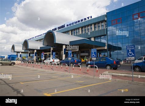 Bucharest Romania Otopeni Airport international departures building exterior with empty disabled ...