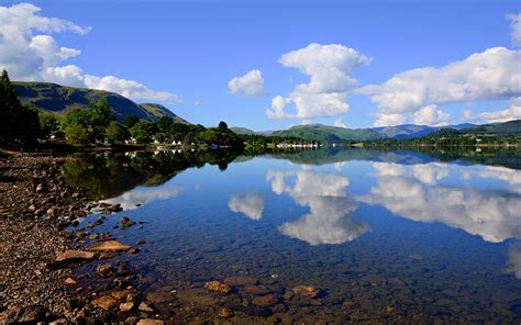 English Countryside Lake District Ullswater With Mountains And Blue Sky On Beautiful Still Day ...