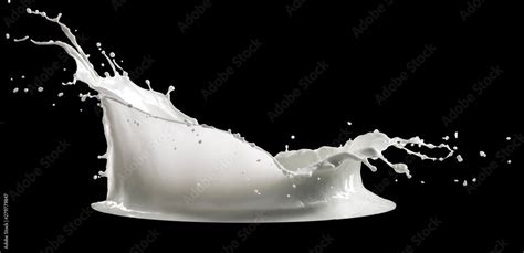 milk splash isolated on black background Stock Photo | Adobe Stock