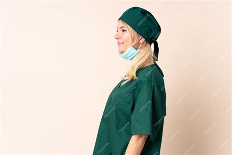 Premium Photo | Surgeon woman in green uniform over isolated background ...