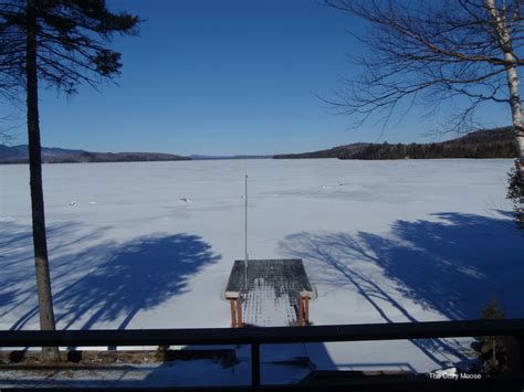 Winter in Maine, Snow covered Moosehead Lake reflections amidst blue ...