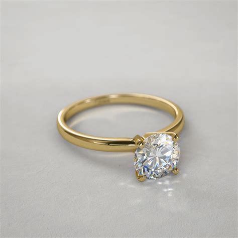 TIMELESS FOUR-PRONG ROUND SOLITAIRE ENGAGEMENT RING IN 18K YELLOW GOLD