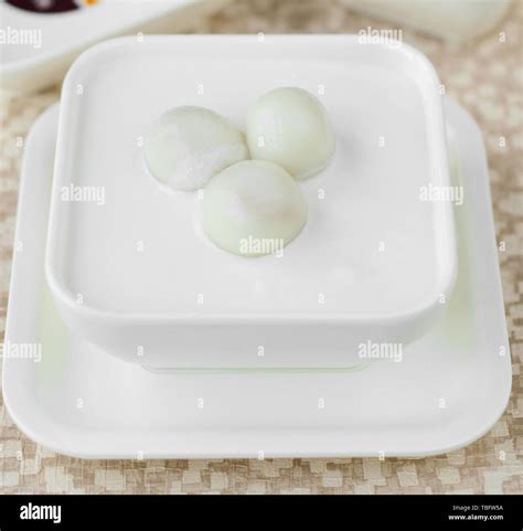 Coconut milk dumplings Stock Photo - Alamy