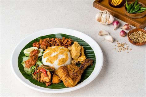 Premium Photo | Nasi Padang with chicken rendang is an Indonesian food ...