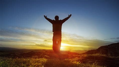 9-12-CH Silhouette of man facing sun arms raised in praise