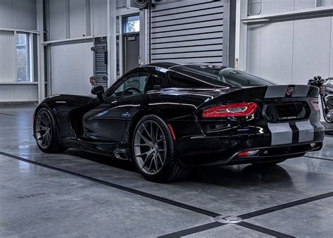 a black sports car parked in a garage