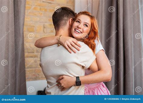 Happy Young Girl Hugging Her Young Boyfriend and Smiling Cheerfully ...