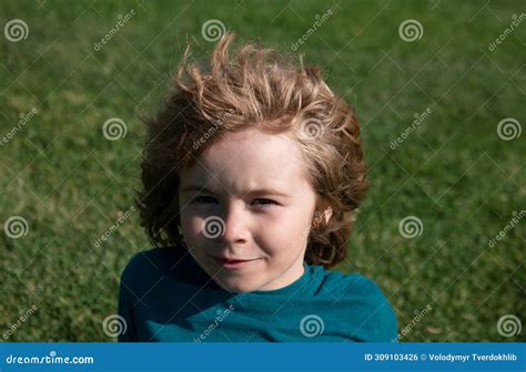 Funny Child Face Close Up. Kids on Grass in Park Head Portrait. Stock ...