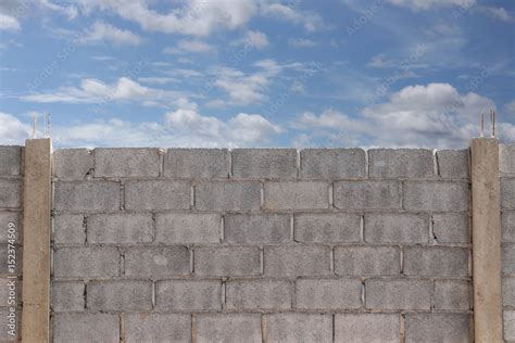 surface of Construction brick or old cement wall and blue sky ...