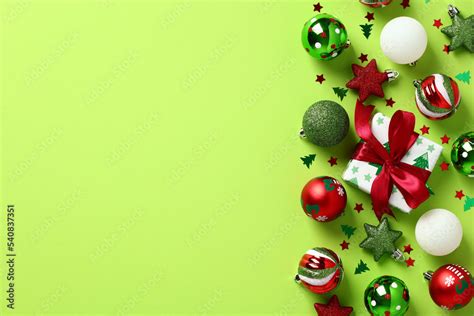 Red and green Christmas decorations on light green background ...