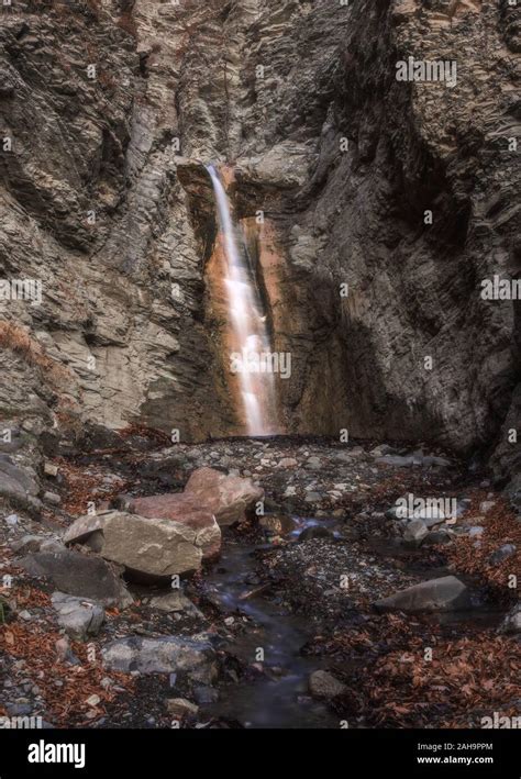 Waterfall in a mountain gorge Stock Photo - Alamy