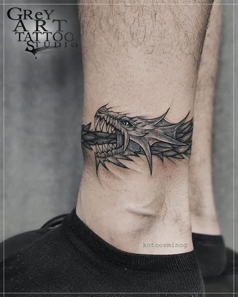 Dragon ouroboros tattoo 3 | Wrist tattoos for guys, Ouroboros tattoo, Band tattoo designs