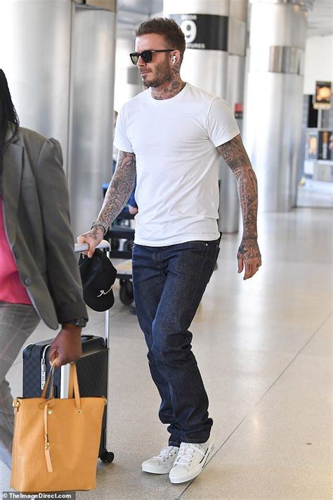 David Beckham displays his heavily-tatted arms as he arrives in Miami | David beckham style ...