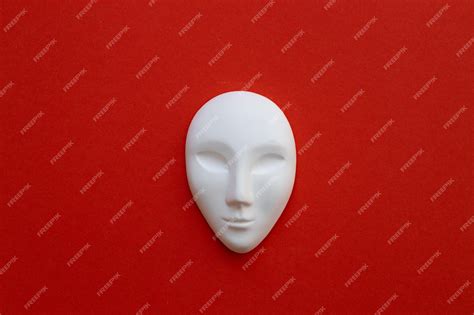 Premium Photo | Ceramic white mask on red background