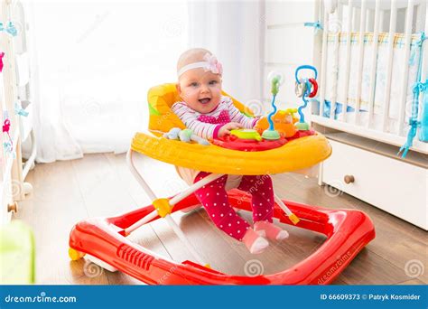 First Steps in a Baby Walker Stock Image - Image of happiness, home ...