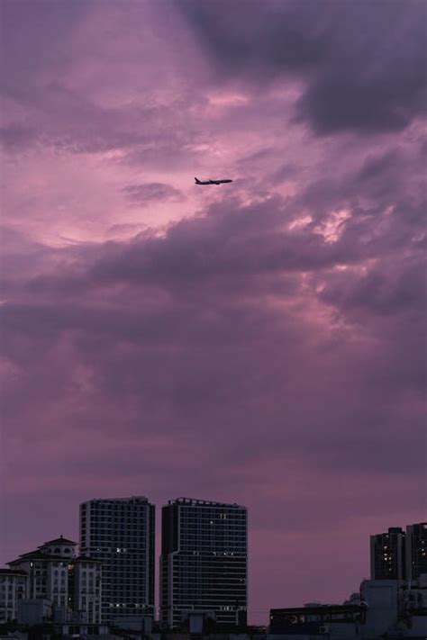 Airplane in Purple Sky at Sunset · Free Stock Photo