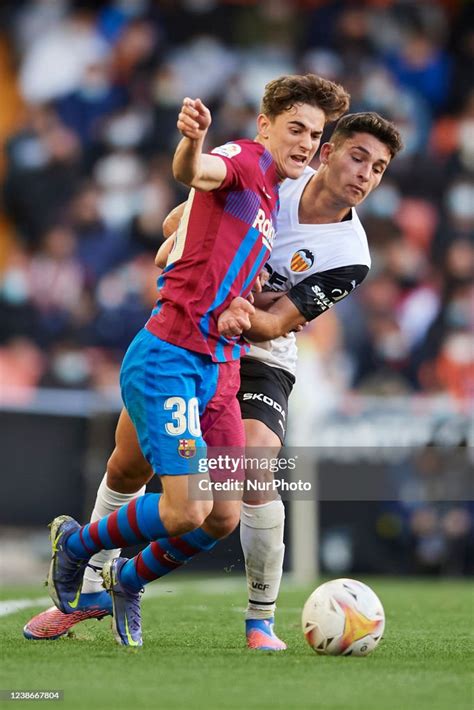 Gavi of Barcelona and Hugo Duro of Valencia compete for the ball ...