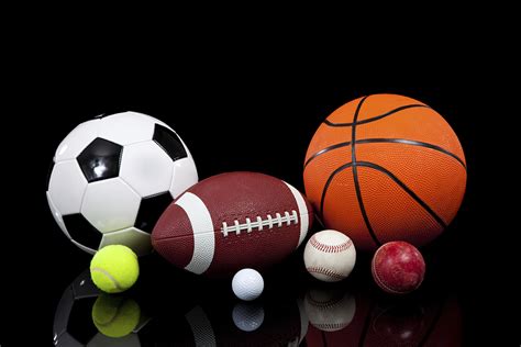 Assorted sports balls on a black background – Carol City Elementary