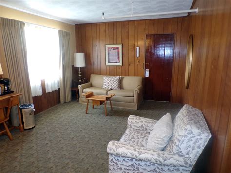 Rocky Top Room living room with vintage furniture - The Historic Gatlinburg Inn