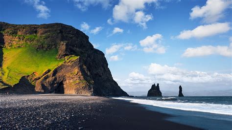 Reynisdrangar rock formations at Reynisfjara Beach, Atlantic ocean coast near Vik, Iceland ...