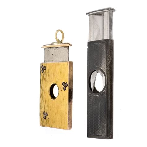 Two Vintage Cigar Cutters | Kodner Auctions