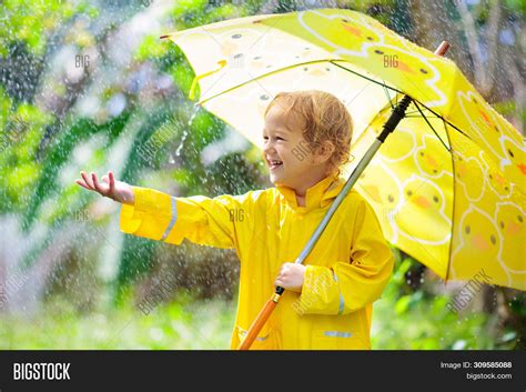 Child Playing Rain. Image & Photo (Free Trial) | Bigstock