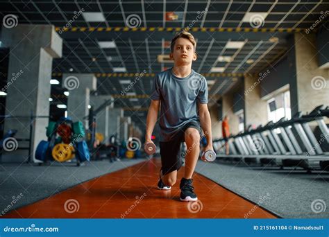 Boy Doing Exercise with Dumbbells in Gym Stock Photo - Image of sporty ...