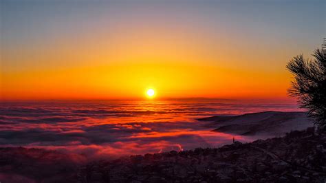 View Of Clouds Covered Hills Under Golden Sunset HD Sunset Wallpapers ...