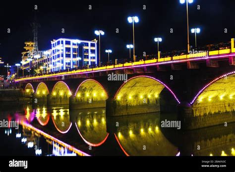 Stone arch bridge in the night Stock Photo - Alamy