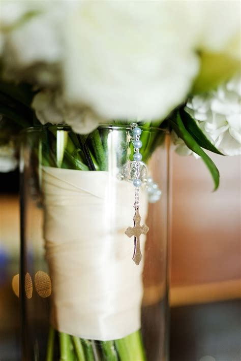 white bridal bouquet with rosary